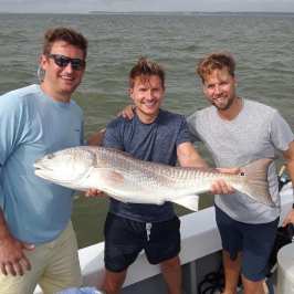 a man holding a fish
