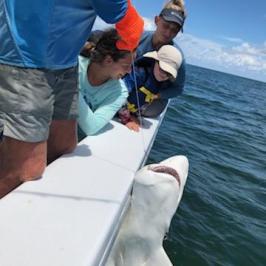 a group of people on a boat in the water