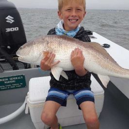 a person holding a fish