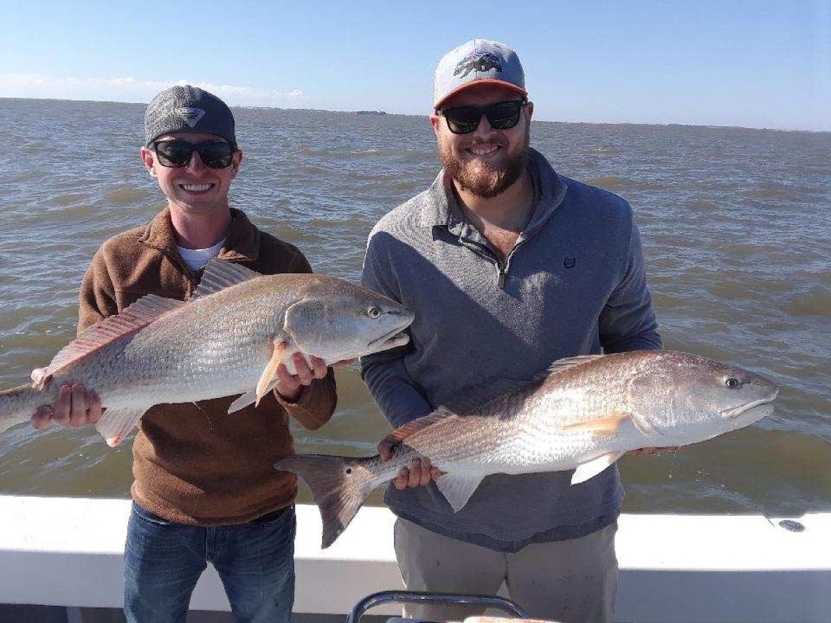 a person holding a fish