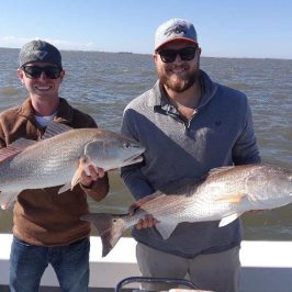 a person holding a fish