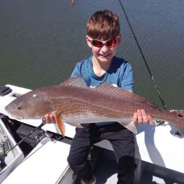 a man holding a fish