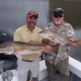 a man holding a fish
