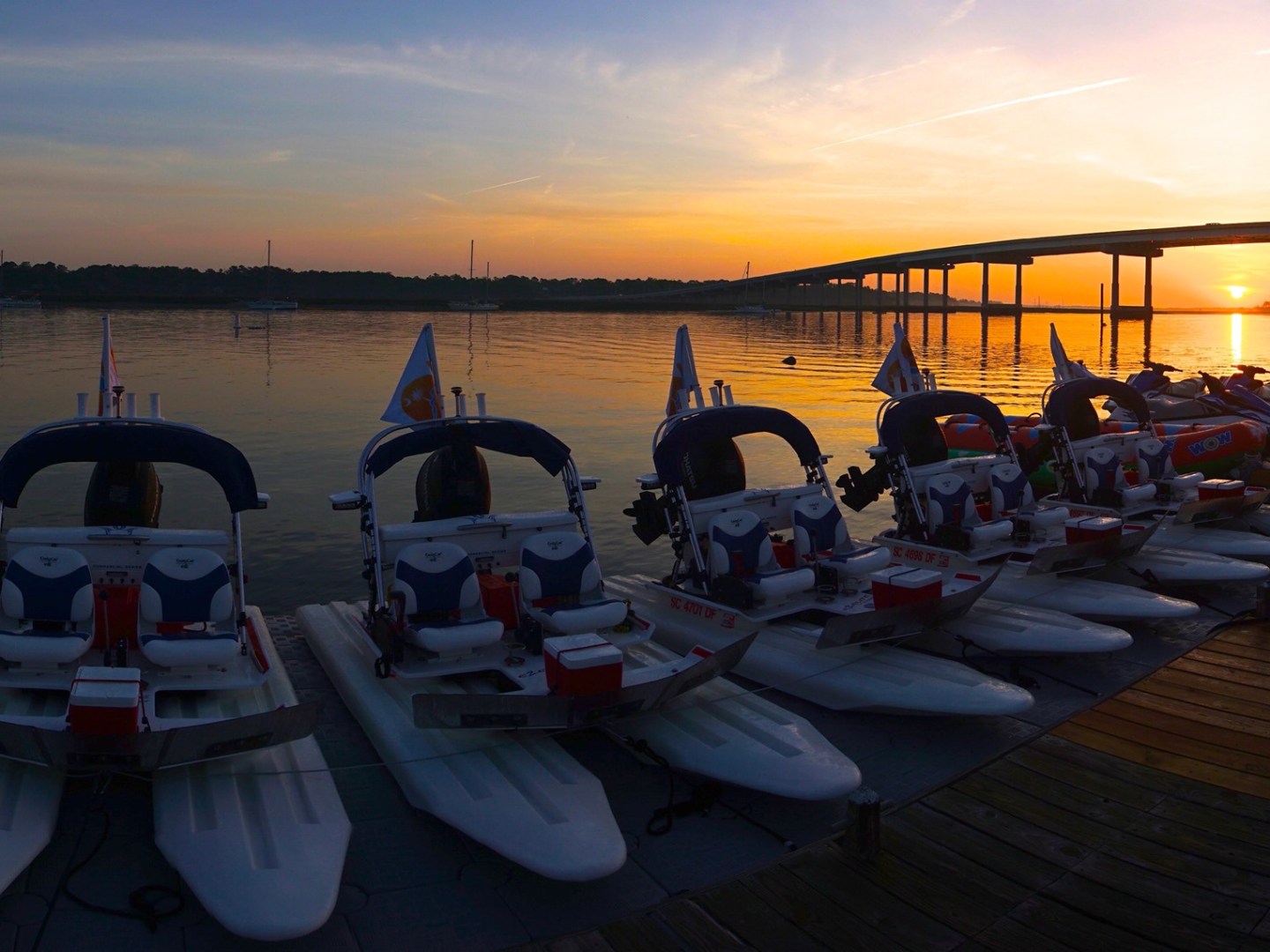 a picnic table next to a body of water